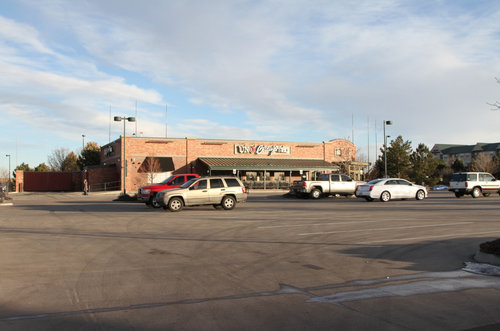 Parking lot containing about five vehicles