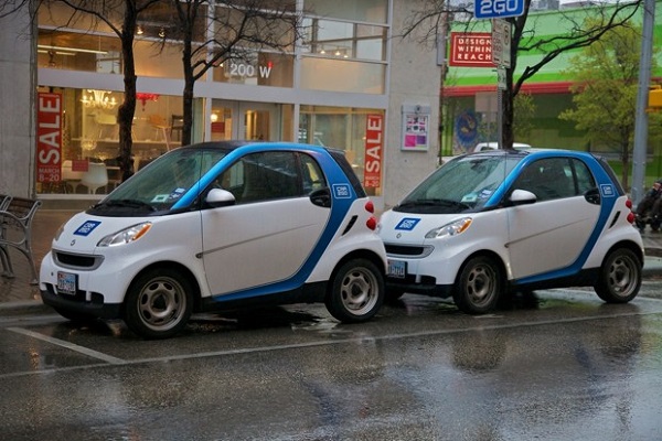 Two shared cars in one parking space