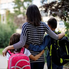 mother-with-children-wearing-backpacks-resized